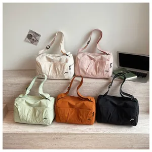 Japanese minimalist large capacity travel shoulder bag displayed in multiple colors.