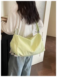 Light green travel gym duffel bag large capacity casual shoulder crossbody bag for outdoor trips.