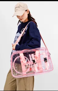 Clear PVC travel fitness bag with pink straps, waterproof design for gym and beach use.