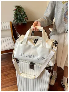White sports duffel bag for travel, gym, and fitness with dry wet separation and shoulder strap.