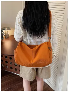 Lightweight crossbody fitness travel bag with large capacity, ideal for daily casual use.