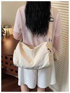 Large capacity canvas crossbody bag casual travel shoulder bag for daily commute and outdoor.