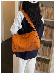 Minimalist orange travel duffel bag, large capacity shoulder bag for short trips and leisure.