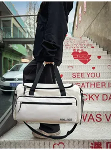 Large capacity color-block travel duffel bag for gym, sports, and fitness with dry-wet compartments.