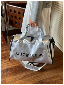 Silver fitness sports duffel bag detail showing durable handle and custom logo print.