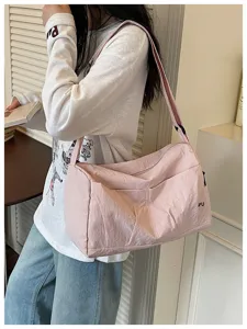 Pink large capacity travel bag shoulder bag detail view, lightweight casual luggage design.