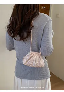 Back view of a pink striped checkered drawstring cloud bag for stylish daily outfits
