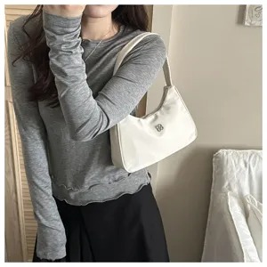 Close-up detail of a minimalist white Korean-style hobo shoulder bag for women