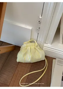 Yellow and white gingham striped crossbody bag with sophisticated retro minimalist vibe