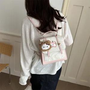 Zaino mini rosa e bianco effetto marmo con toppa mela lucky e ciondolo in peluche