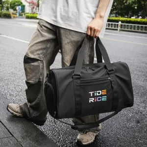 Black athletic gym duffel bag with shoe compartment, wet dry separation for travel sports.