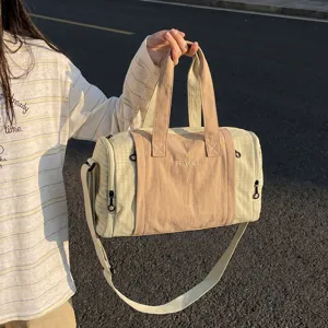 Lightweight travel duffel bag with grid pattern, large capacity gym bag for women.