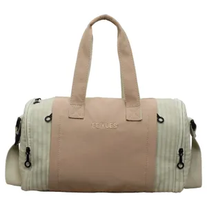 Large capacity canvas travel duffel bag for women, lightweight gym and weekend overnight bag.