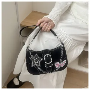 Detail view of a Y2K black baguette bag featuring star patches and silver chain