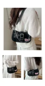 Detailed view of black Y2K star baguette shoulder bag with silver chain and belt buckle