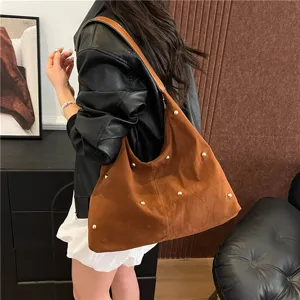 Large brown suede-like shoulder bag featuring gold stud accents for a stylish look