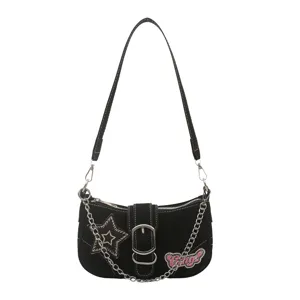 Y2K millennium style black underarm bag with star patch and silver chain strap