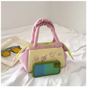 Süße farblich abgesetzte Kosmetiktasche in Rosa und Gelb mit Handy zum Größenvergleich