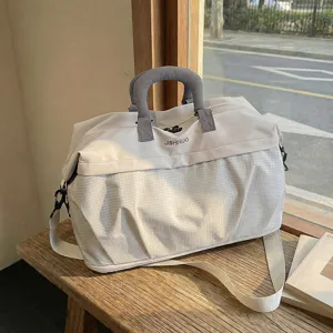 Large capacity travel duffel bag with grid pattern, stylish portable gym luggage bag for short trips.