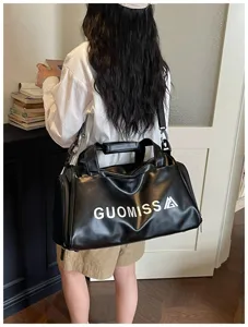 Black leather duffel bag for gym, fitness, sports training, and short travel trips.