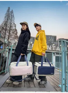 Versatile color-block travel duffel bag with large capacity, dry-wet separation design for gym.