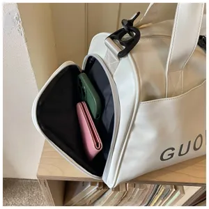 White PU leather gym duffel bag detail showcasing side zipper pocket and spacious interior storage for travel.