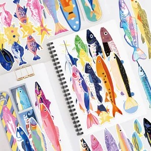Detailed view of colorful fish bookmarks and stickers, perfect for journaling and decoration.