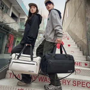 Large capacity travel duffel bag for men and women, durable sports fitness gym bag.