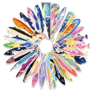 Close-up of creative colorful fish bookmarks and journal cards, artistic stationery detail.