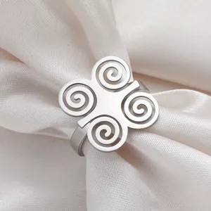 Detailed macro view of stainless steel ring with African spiral cultural symbols