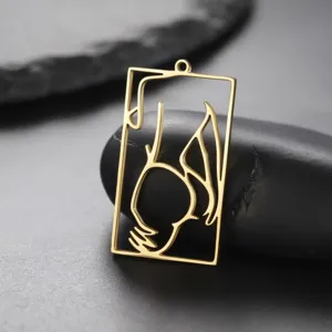 Gold-toned stainless steel rectangular pendant featuring an artistic female body silhouette