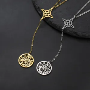 Close-up of gold and silver Witch's Knot necklaces with hollow pentagram pendants