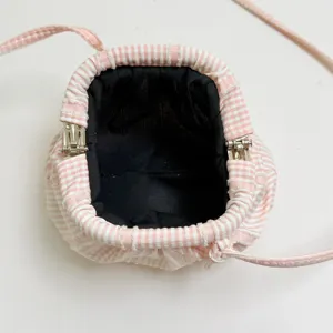 Pink striped gingham small crossbody bag with metal frame open top and black lining