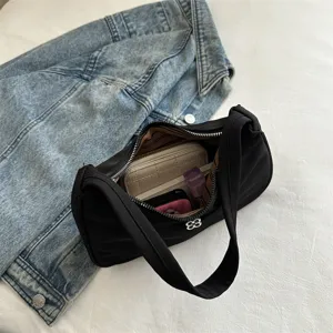 Elegant black fabric shoulder armpit bag for women with minimalist design and wide strap