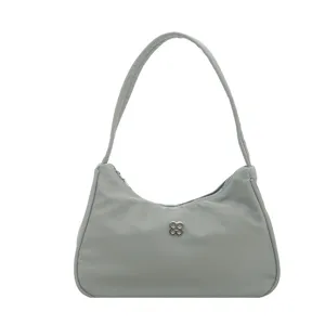 Simple women's light sage green underarm shoulder bag with metal clover logo
