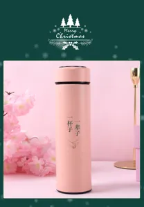 Pink smart thermos detail view featuring romantic couple text and cherry blossom scene decor.