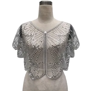 Detailed macro view of silver sequined and beaded vintage party dress capelet shrug
