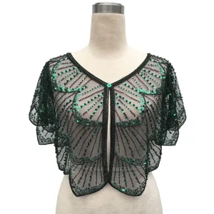 Vintage black mesh shrug featuring intricate green sequins and elegant black beadwork