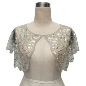 Detailed view of vintage silver sequined capelet shawl with elegant beadwork floral patterns