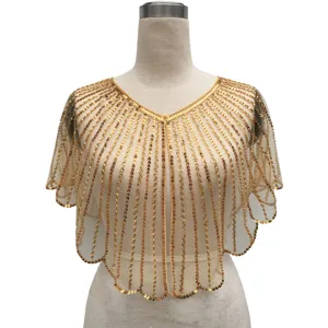 Detailed view of vintage gold sequin shawl with intricate beadwork for party dresses