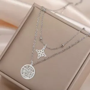 Close-up of stainless steel double-layer necklace with Celtic knot and pentagram charms