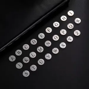 Detailed macro view of 26 stainless steel capital letter pendants for jewelry making