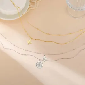 Close-up of stainless steel double-layer necklaces featuring witch's knot and pentagram charms