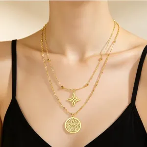 Detail shot of double-layer stainless steel necklace with witch's knot and pentagram