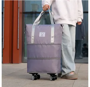 Large capacity purple travel bag with swivel wheels and expandable zipper layers