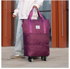 Large purple foldable travel bag with 360-degree wheels shown in an outdoor setting