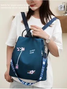 Floral embroidered anti-theft backpack for women in blue oxford fabric with straps