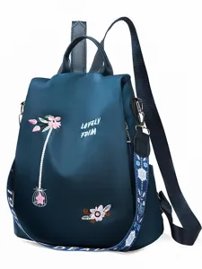 Navy blue Oxford backpack with elegant floral embroidery and secure anti-theft design