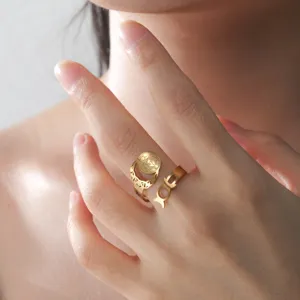 Detailed view of a Triple Moon Goddess adjustable gold ring made of stainless steel