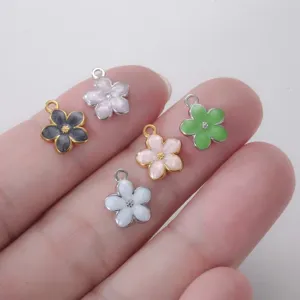 Macro shot of colorful stainless steel enamel daisy flower charms for DIY jewelry making